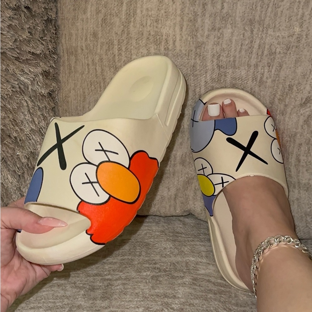 KAWS White Slip-on Slides sizes 8, 9, 10 left